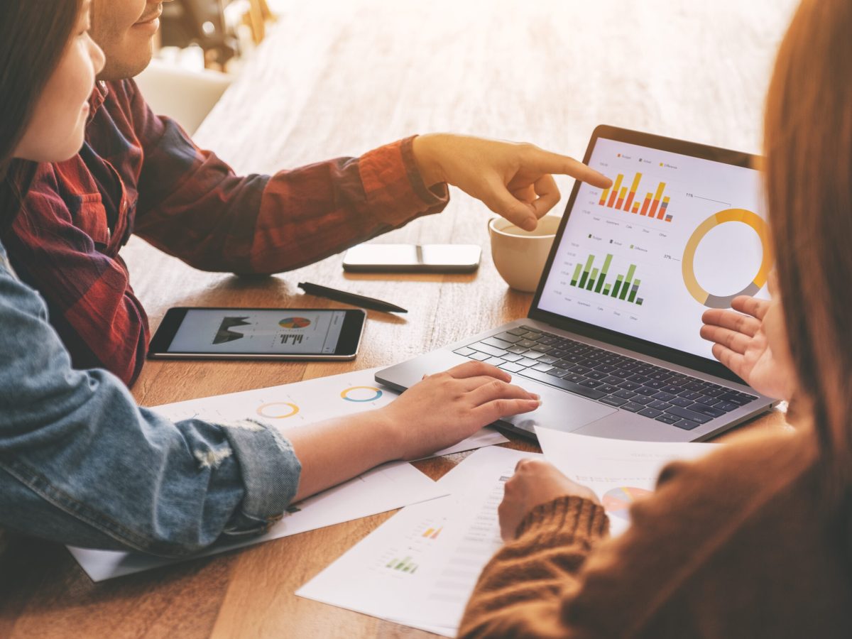 Three businessman working and discussing business together in a meeting